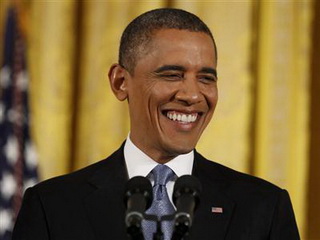 Tổng thống Mỹ Barack Obama lạc quan về triển vọng kinh tế Mỹ năm 2014 - Ảnh: Reuters