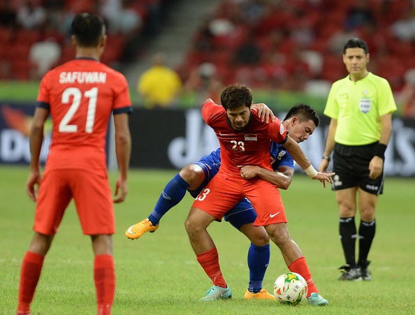 Trận đấu giữa Thái Lan và Singapore diễn ra hấp dẫn và có chất lượng chuyên môn cao (Ảnh: AFP).