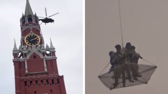  Một trực thăng bay qua điện Kremlin (bên trái), trong khi 4 quân nhân có vũ trang bịt mặt đứng trên 1 lưới treo lơ lửng phía dưới một trực thăng khác (Ảnh: RT)