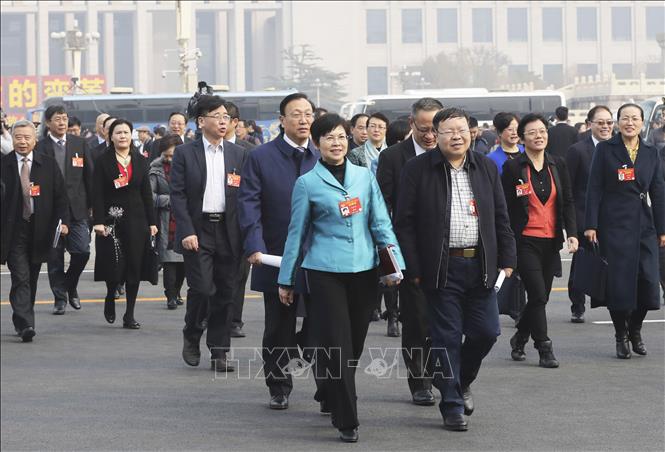 Các đại biểu tới dự kỳ họp lần thứ hai, khóa XIII Hội nghị Chính trị Hiệp thương Nhân dân toàn quốc Trung Quốc tại Bắc Kinh ngày 3-3-2019. Ảnh: THX/TTXVN