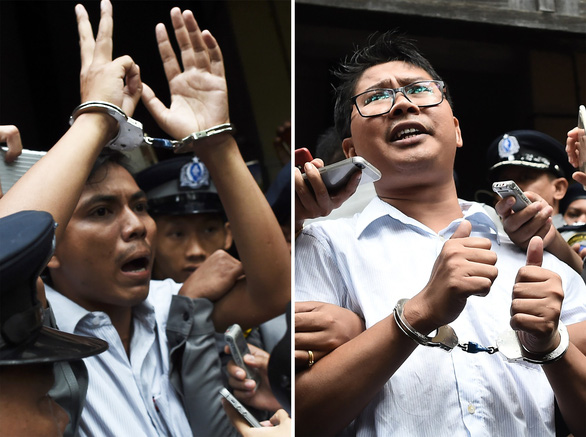 Hai nhà báo Kyaw Soe Oo (trái) và Wa Lone của Hãng tin Reuters bị giam hơn 16 tháng kể từ thời điểm bị bắt tháng 12-2017. Ngày 7-5 họ đã được thả tự do theo lệnh ân xá của chính phủ Myanmar - Ảnh: AFP