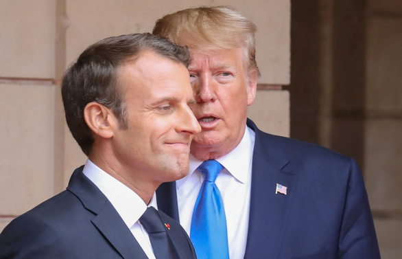  Tổng thống Mỹ Donald Trump (phải) trao đổi với người đồng cấp Pháp Emmanuel Macron tháng 6-2019. Pháp là nước chủ nhà hội nghị thượng đỉnh G7 năm nay - Ảnh: REUTERS