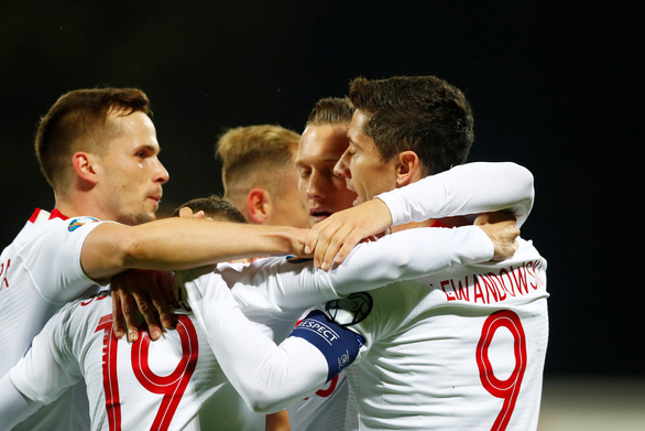 Đội tuyển Ba Lan cũng xuất sắc đoạt vé đầu bảng G sau chiến thắng 2-0 trước Macedonia - Ảnh: Reuters