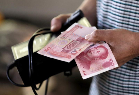 Tiền giấy của Trung Quốc - Ảnh minh họa: REUTERS