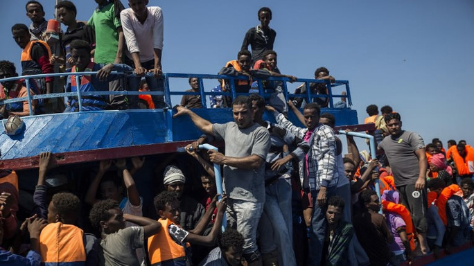 Nhiều người di cư được giải cứu khỏi Libya là những người tị nạn từ các cuộc chiến ở Syria, Iraq và Afghanistan. Ảnh: CGTN
