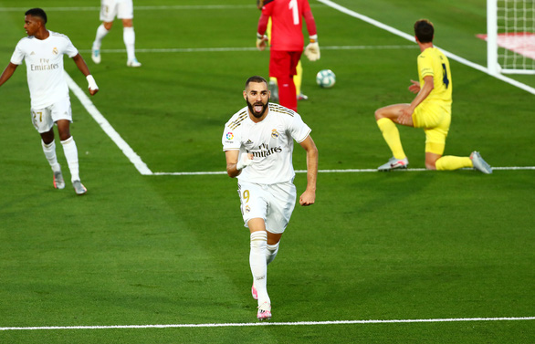 Benzema tỏa sáng giúp Real Madrid đánh bại Villarreal để đăng quang La Liga - Ảnh: REUTERS
