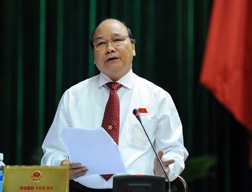 Phó Thủ tướng Nguyễn Xuân Phúc trả lời chất vấn trước Quốc hội. Ảnh VGP/Nhật Bắc