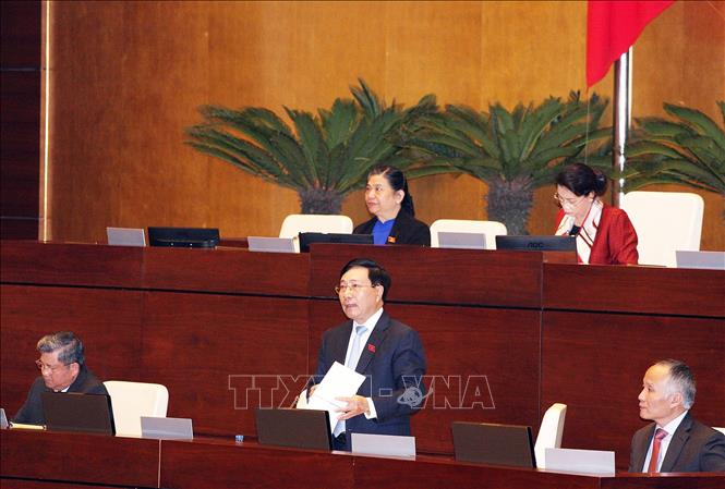  Phó Thủ tướng, Bộ trưởng Bộ Ngoại giao Phạm Bình Minh giải trình ý kiến của đại biểu Quốc hội về Hiệp định CPTPP. Ảnh: Nguyễn Dân/TTXVN