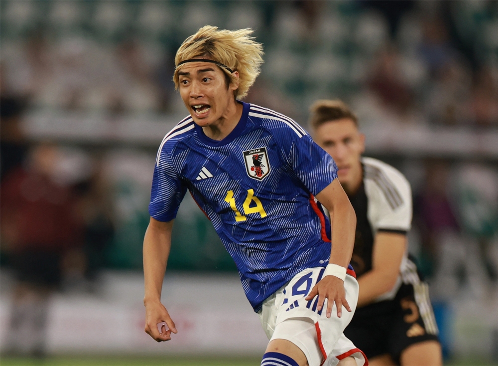 Junya Ito ăn mừng sau khi ghi bàn mở tỉ số cho Nhật Bản trước Đức - Ảnh: REUTERS